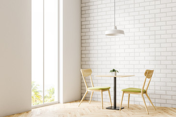 Wooden table and chairs in minimalism cafe corner