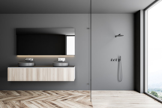 Double sink in a gray bathroom interior, shower