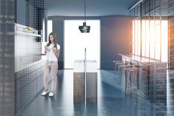 Gray kitchen with gray bar, woman