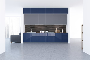 White kitchen interior, blue countertops