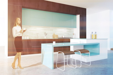 Black and blue original kitchen, blonde woman