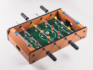 Mini table football foosball soccer with players and ball. isolated