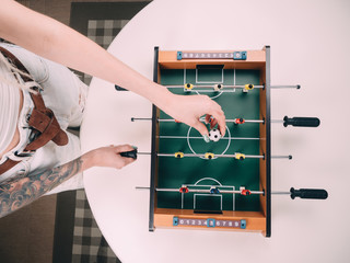 Mini table football foosball soccer with girl hands