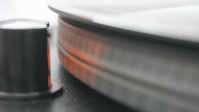 Close up movie of a record player playing a vinyl  record.
