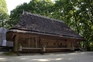 Fototapeta na wymiar Traditional cottage houses with the straw roofs. Ukraine