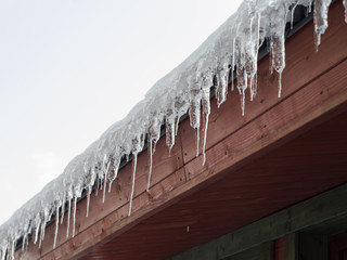 icicles on the roof of the cottage