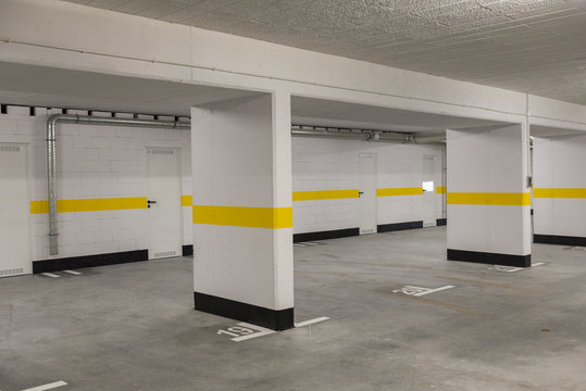 Typical underground car parking garage in a modern apartment house.
