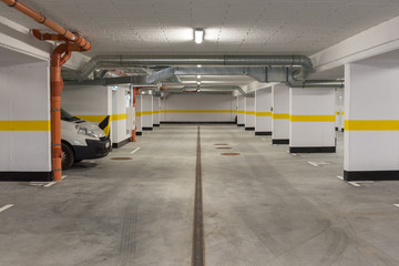 Typical underground car parking garage in a modern apartment house.