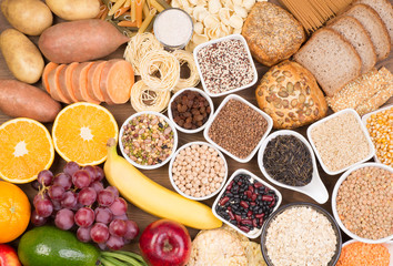 Carbohydrates food sources, top view on a table - obrazy, fototapety, plakaty