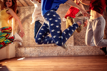 Fototapeta na wymiar Dance team - friends jumping during music