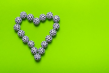 Heart made from  candies, football ball shaped