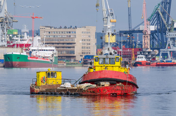 BARGE AND TUGBOAT - Morning traffic at the sea port in Gdynia
