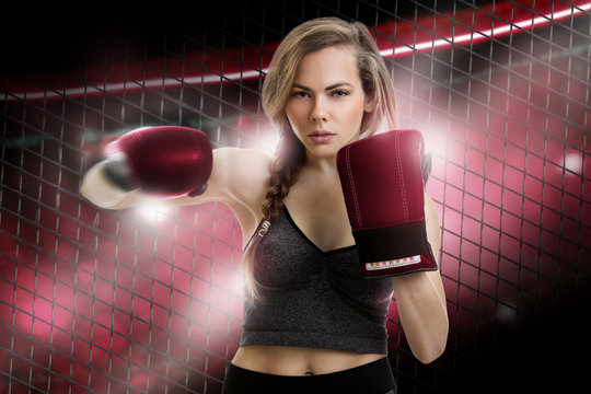 young blonde girl mma fighter in red gloves
