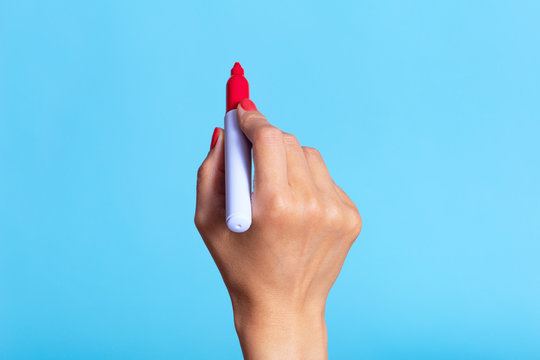 A female hand draws