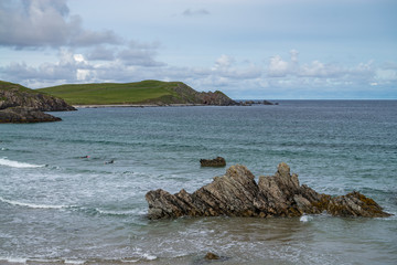Sango Bay beach at Durness with surfers waiting forthe wave