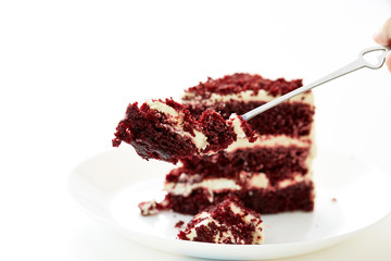 spoon cutting a red dessert