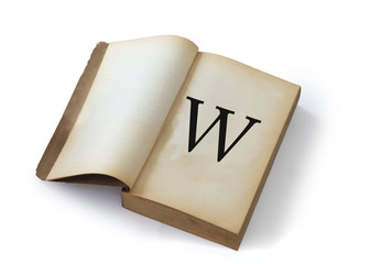 W letter on open old book