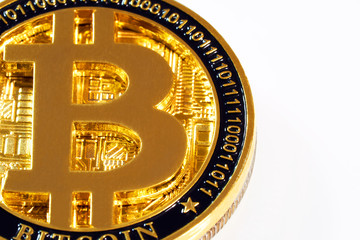 Gold metal coin bitcoin on white background close-up view from above. BTC. Bitcoin cryptocurrency. Anonymous. Virtual currency. Bright abstract background ideal for any design