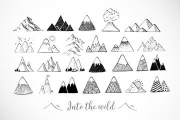 Set of hand drawn doodle sketch mountains on white background