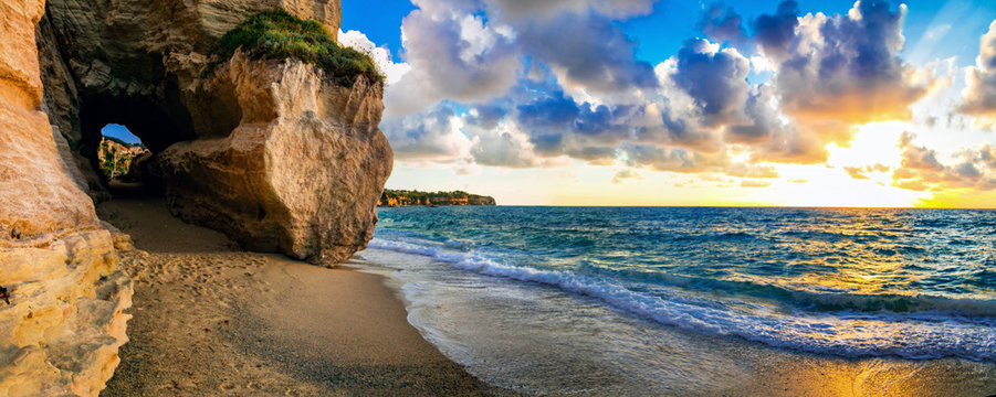 Fototapeta amazing sea sunset in small hidden beach in Tropea, Calabria, Italy