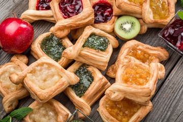 Fresh fruit tart with berries jam , mint on wooden background. Desert. Morning healthy breakfast and evening dinner.