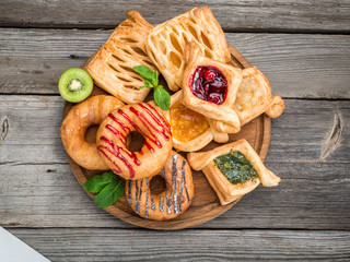 Fresh fruit tart with berries jam , mint on wooden background. Desert. Morning healthy breakfast and evening dinner.