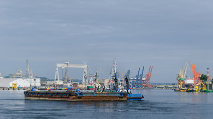 BARGE AND TUGBOAT - Morning traffic at the sea port in Gdynia
