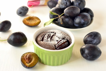 Clafoutis with plums and chocolate, selective focus