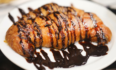 Photo of a macro delicious chocolate croissant