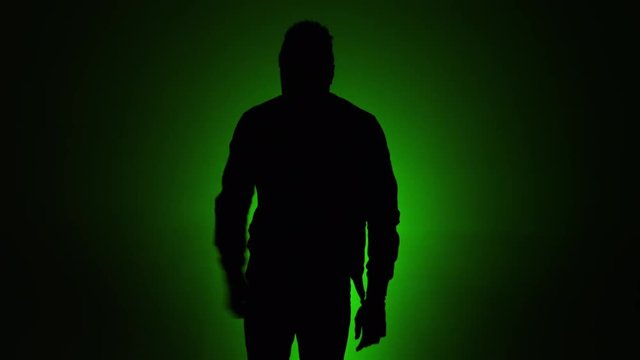 man dancing silhouette green background slomo 2.mov
