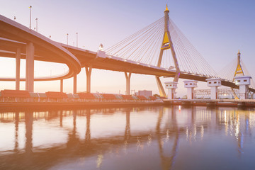 Double suspension bridge river front and white watergate