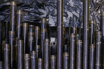 Oil Drill pipe. Rusty drill pipes were drilled in the well section. Downhole drilling rig. Laying...