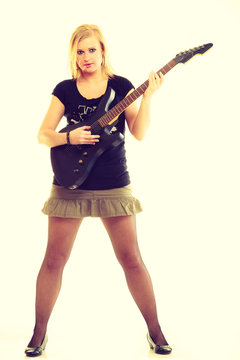 Woman artist player with electric guitar.