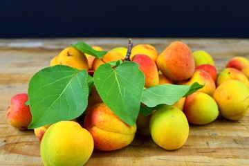 Apricots on wooden background. Apricots from rural garden