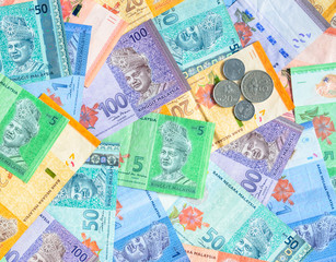 Malaysian ringgit banknotes and coins background. Financial concept.