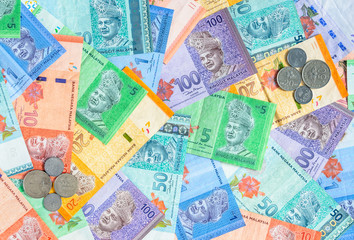 Malaysian ringgit banknotes and coins background. Financial concept.