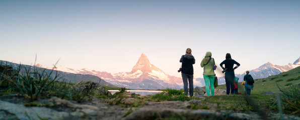 Obraz na płótnie Canvas Photographers looking at Matterhorn Mountain in summer Switzerland