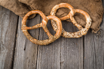 German pretzels on wooden table. Crisp bread from wheat