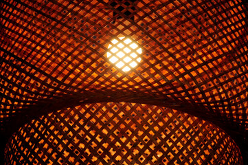 Close-up of bamboo light wicker made from rattan, home decorative in Asian traditional style.