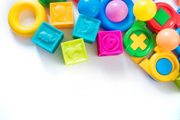 Fototapeta na wymiar Different colored children toys, cubes on white background