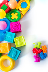 Different colored children toys, cubes on white background
