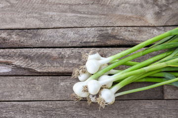 Fresh garlic bulbs on wooden background, top view