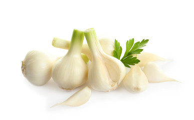 Fresh ripe garlic and parsley on white background