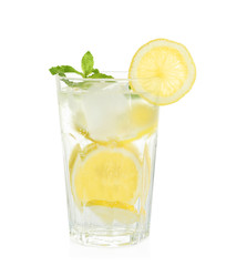 Glass of natural lemonade with mint on white background