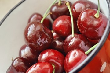 maroon cherry in an iron ladle.