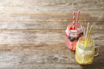 Natural lemonades in mason jars on wooden table