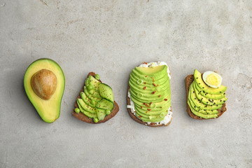 Tasty crisp rye toasts with avocado on table, flat lay © New Africa
