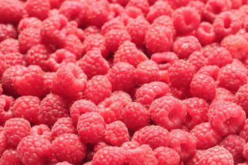 Ripe aromatic raspberries as background