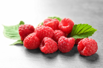 Ripe aromatic raspberries on table, closeup