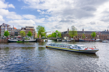 Colorful traditional old buildings in sunshine day at Amsterdam, Netherlands